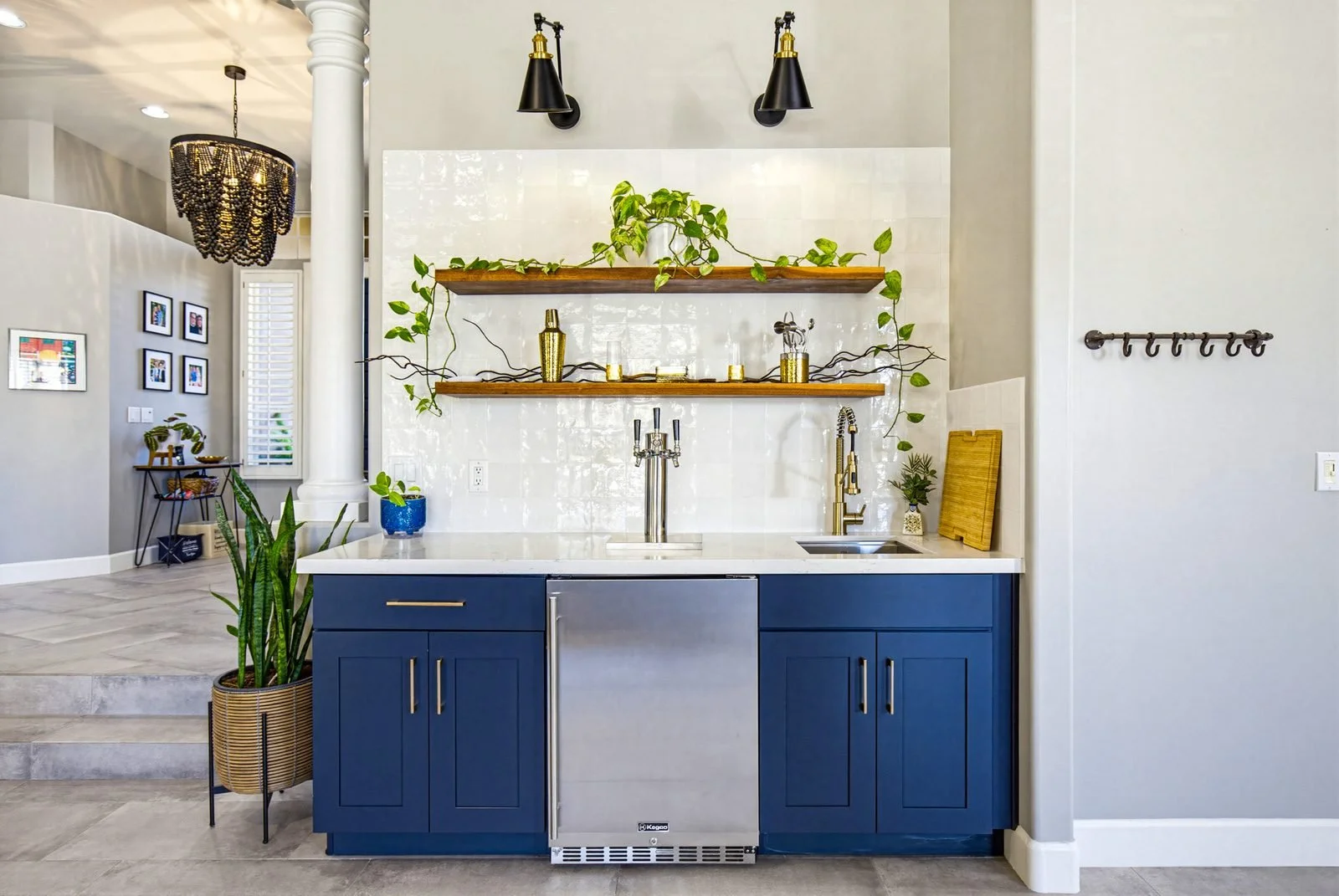 Staged wet bar with blue cabinetry in a Chandler home