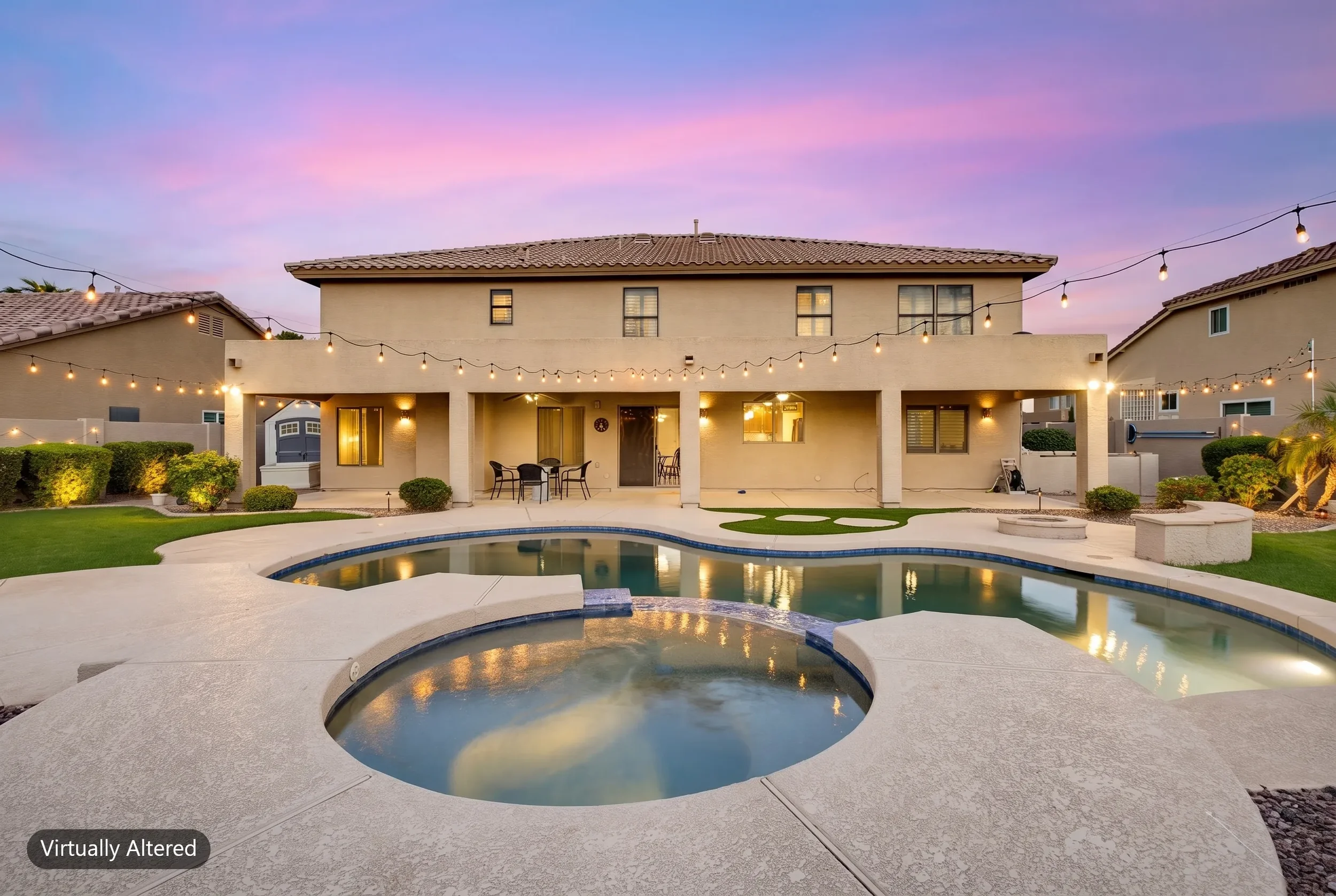 Rear elevation with a pool and spa under a digital twilight sky