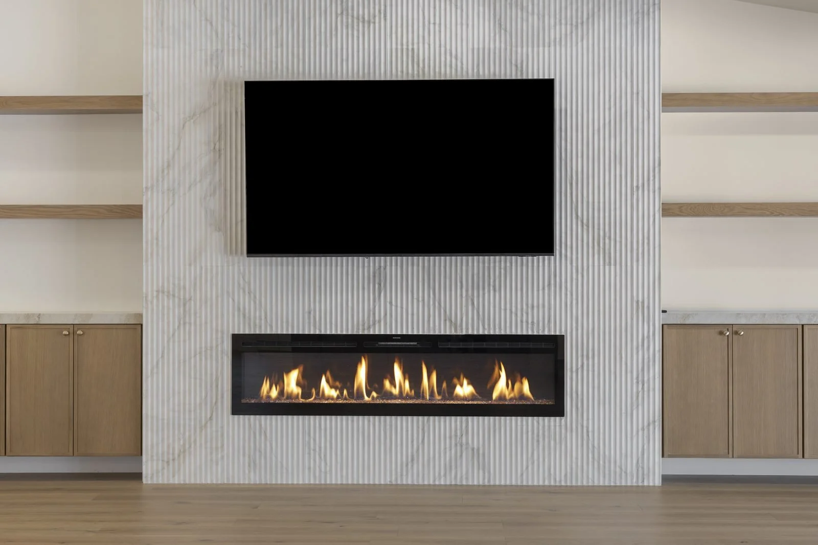 Modern fireplace and media wall with marble tile in a Scottsdale home