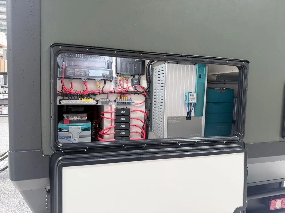 Electrical bay showing Mastervolt inverter/charger, fuse blocks and OEX relay modules