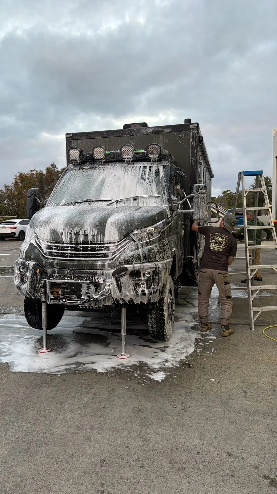 ibeX being foam-washed down outside the Latitude Motorhomes workshop