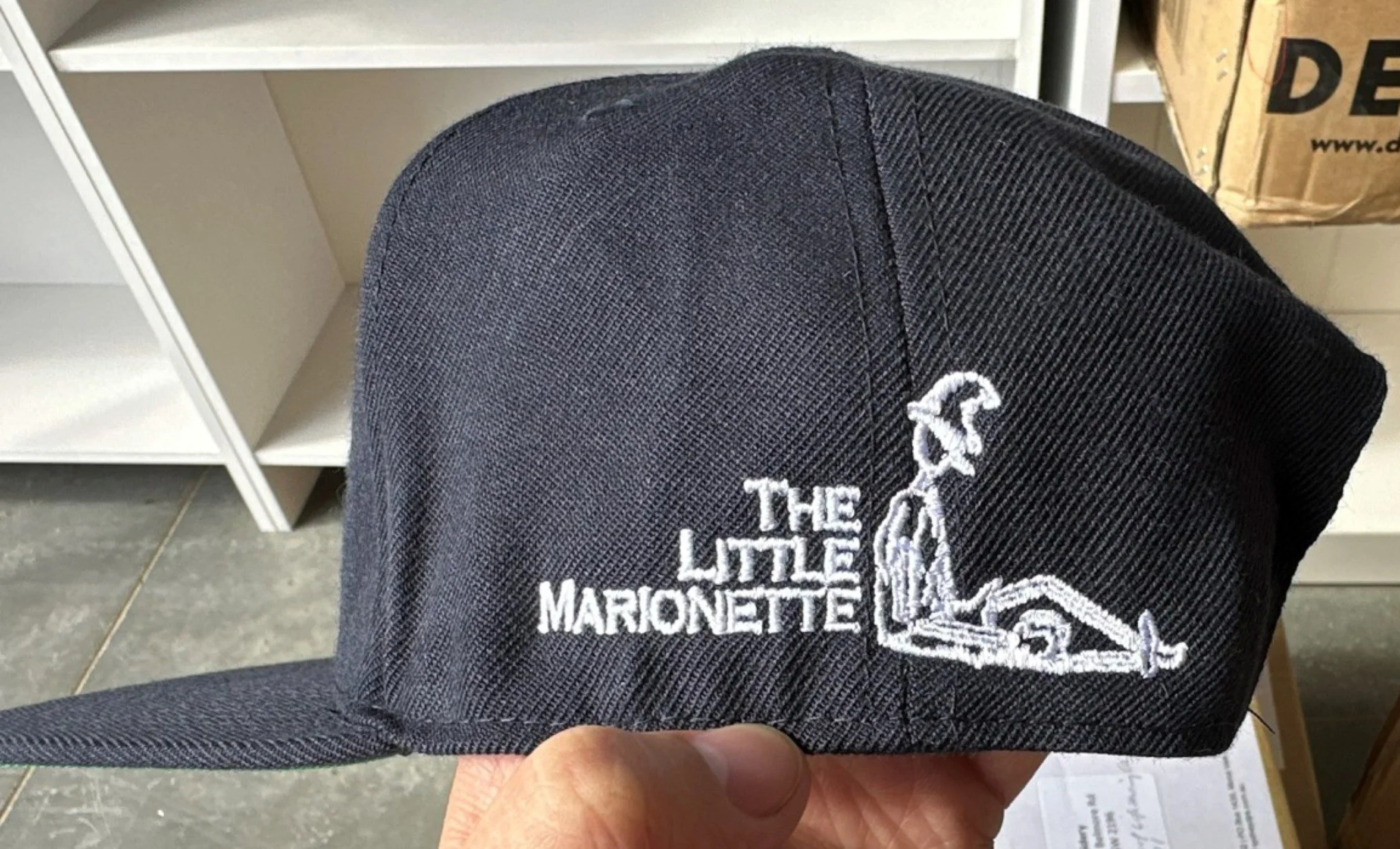 Custom embroidered cafe cap Sydney hospitality uniforms The Little Marionette