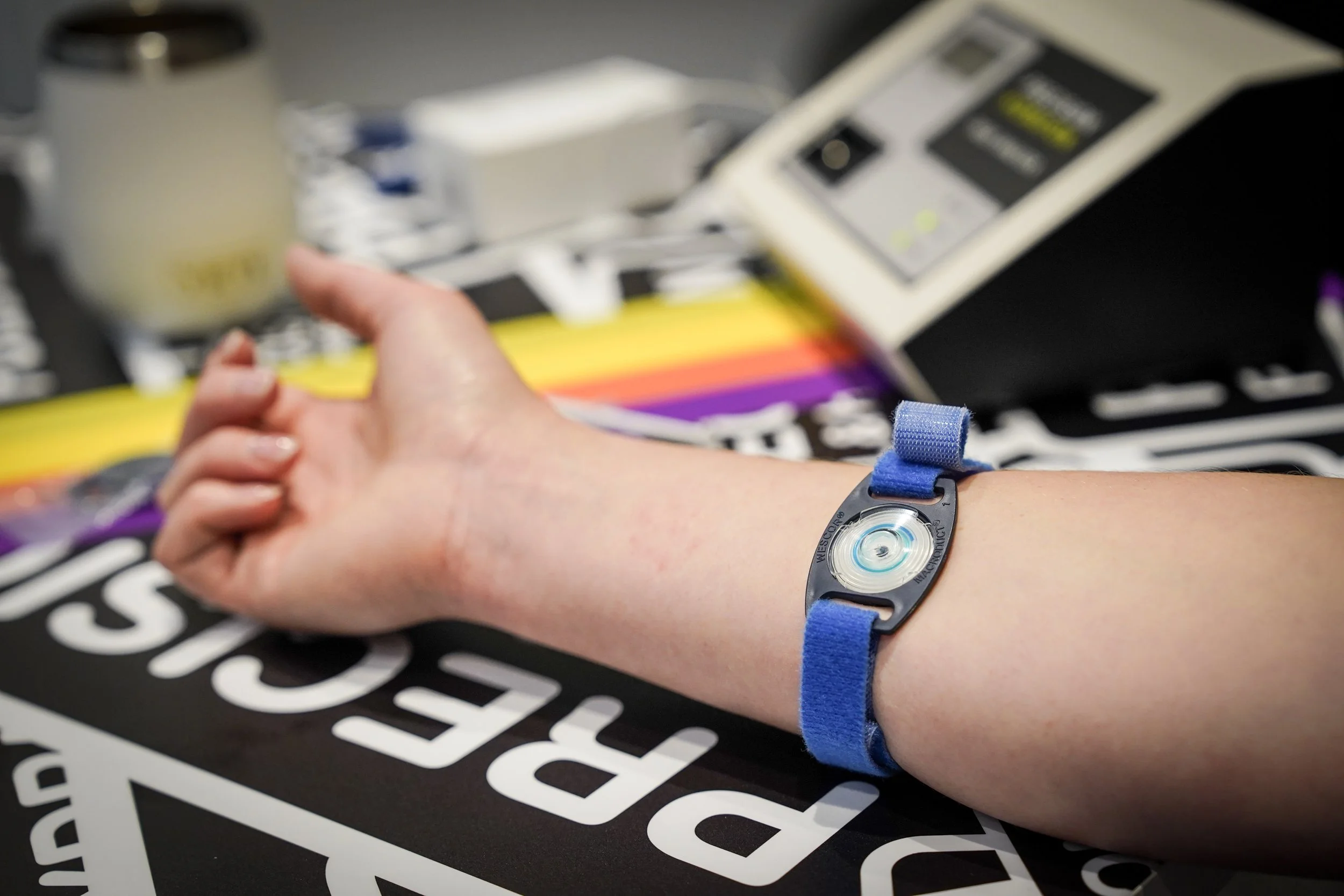 Sweat sensor placed on an athlete's arm during a sweat test