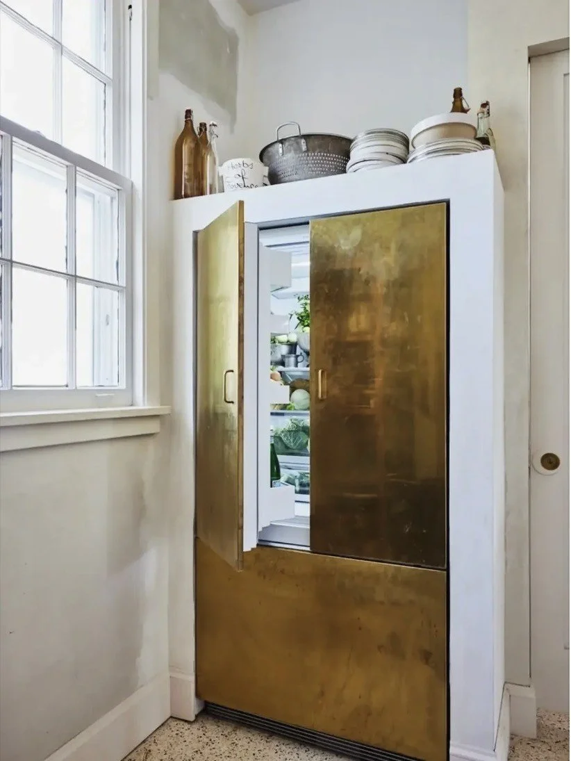 A brass-panelled fridge