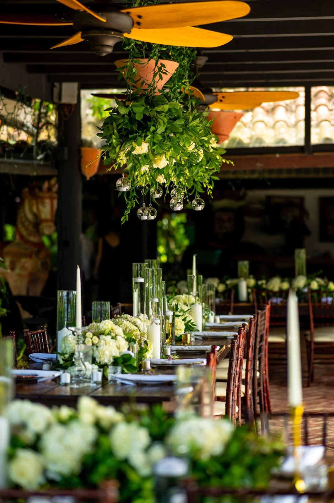 Wedding tablescape with flowers and vibrant napkins