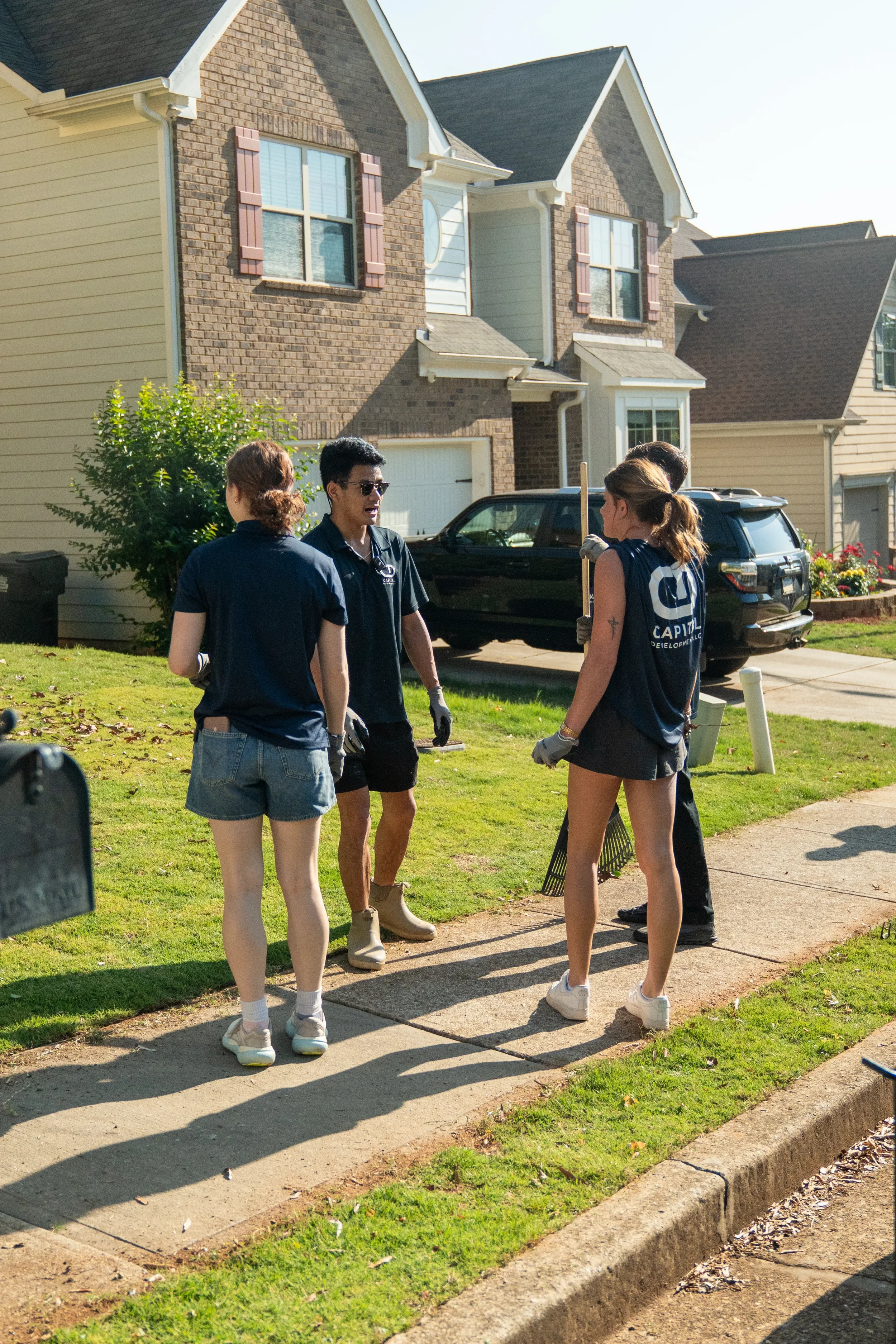 Volunteers clearing yard for family in need Greater Atlanta area