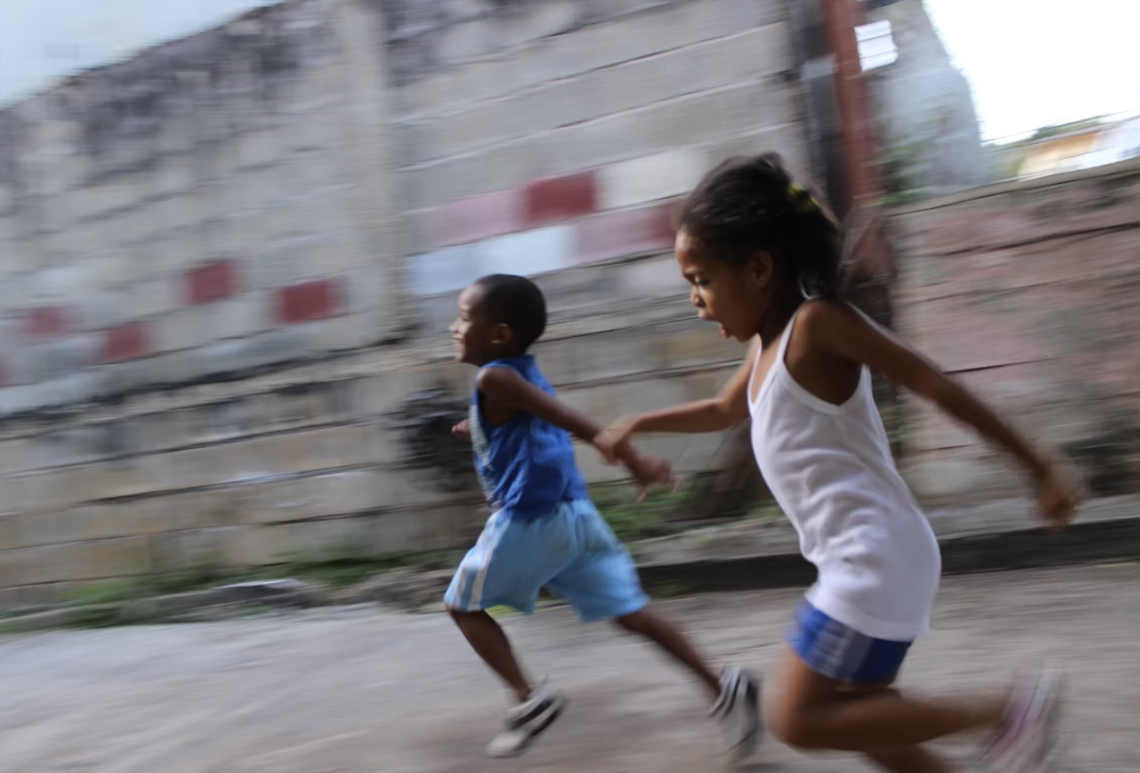 Kids running together in community