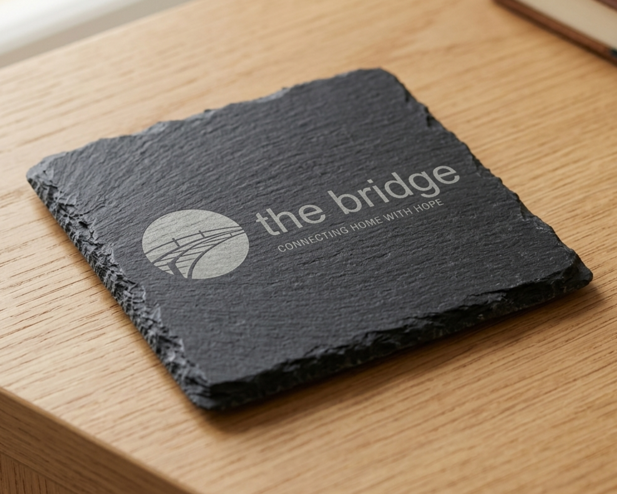 Personalised slate coaster engraved with charity logo for an event