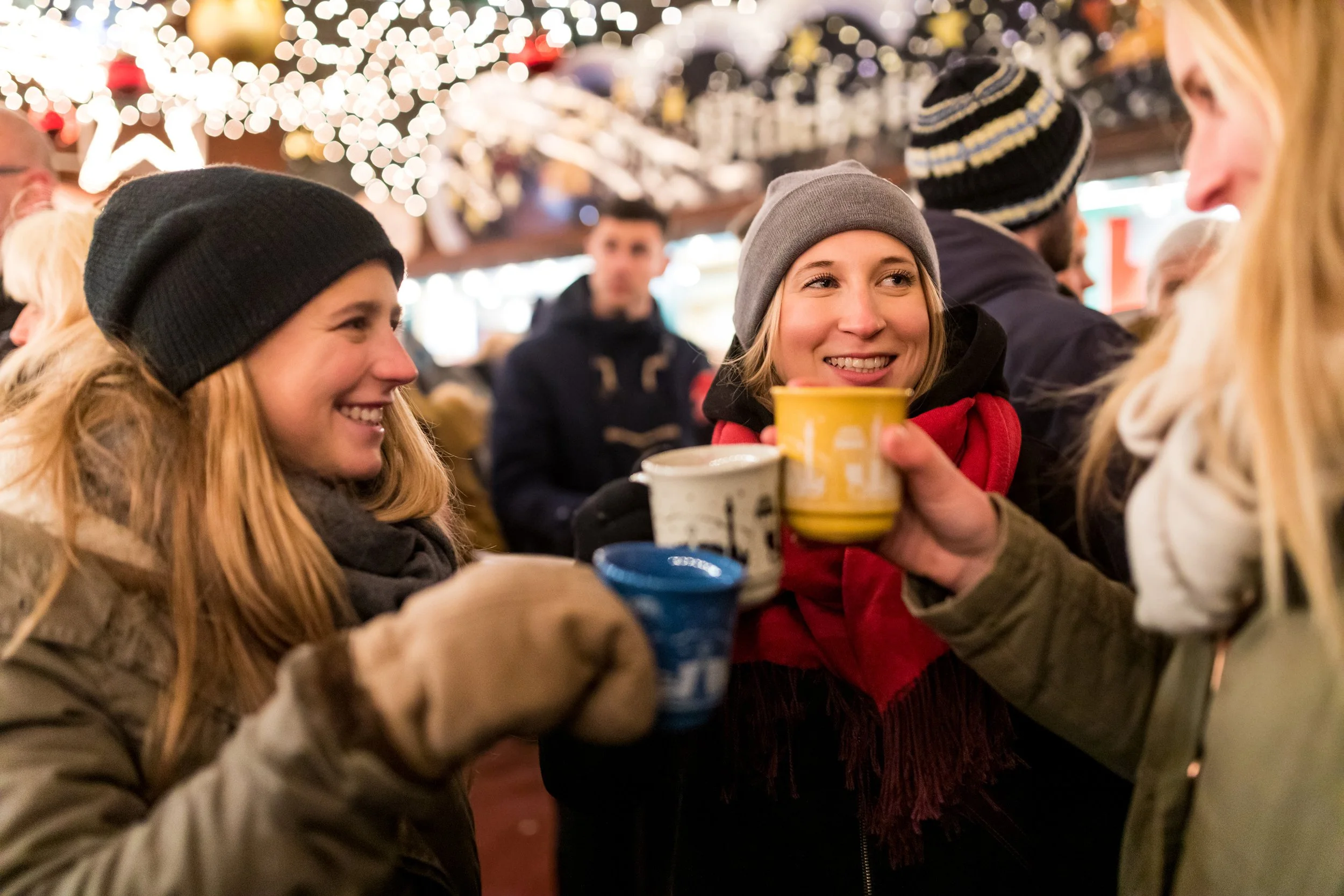 Group toasting with mulled wine at the Christmas market