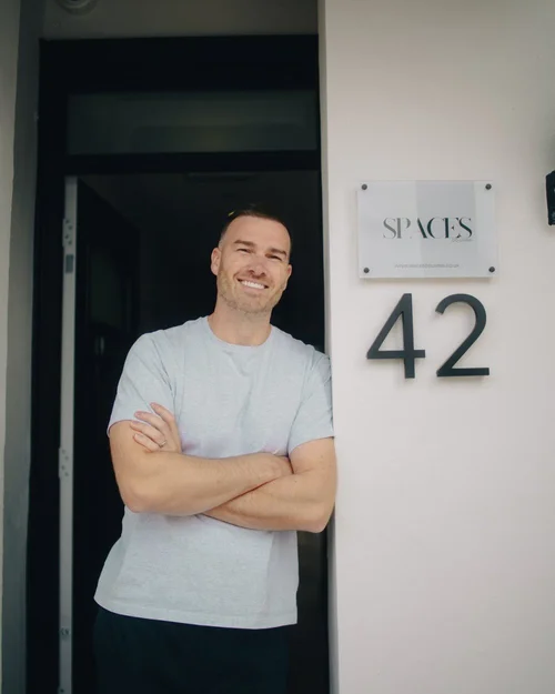 Mitch Nunn standing in the doorway of a Spaces Co-Living property
