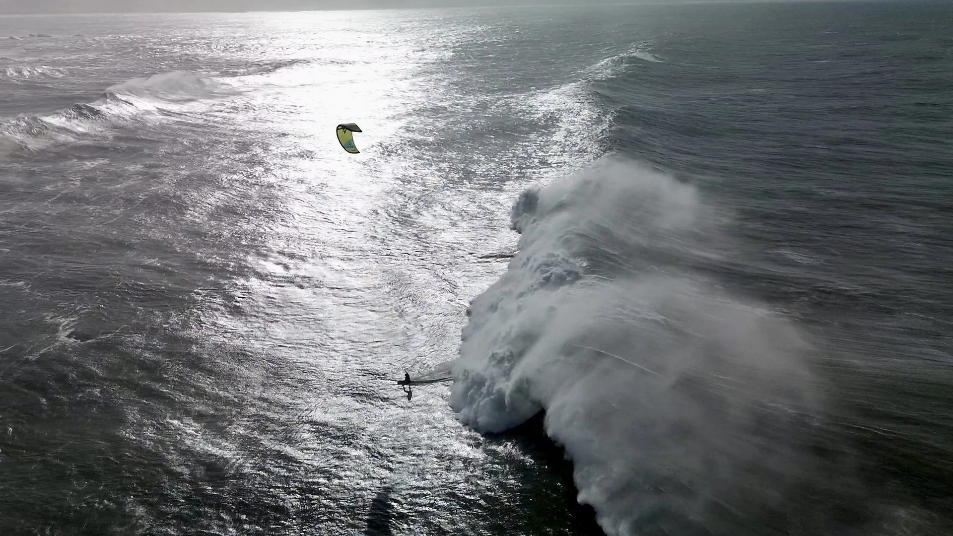 Federico riding a big wave in Nazaré