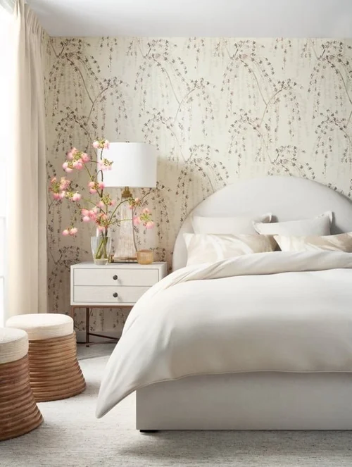 Thibaut cream bedroom inspiration with delicate neutral botanical wallpaper and soft white bedding