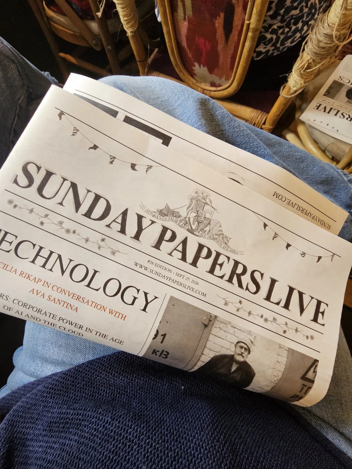 A Sunday Papers Live newspaper resting on my lap during a day out.