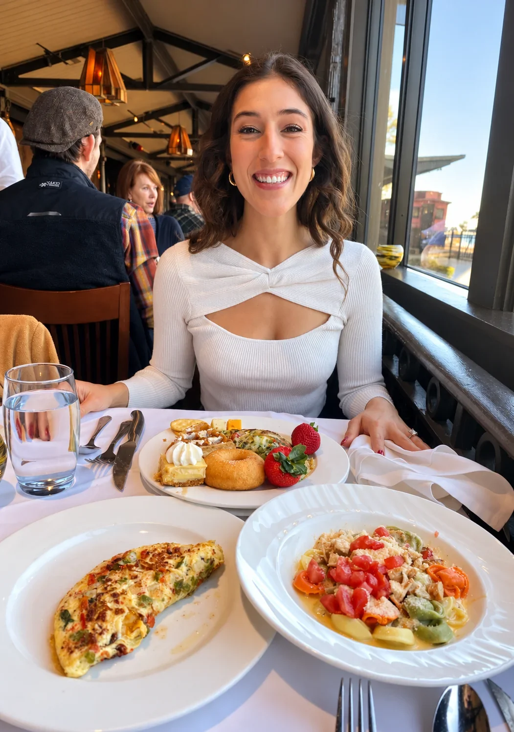 Devon smiling and enjoying a meal