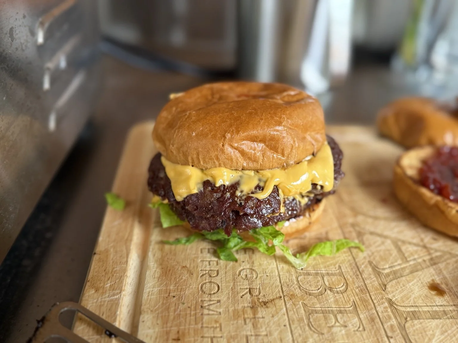 British Griller double smash burger with melted cheese on a toasted bun