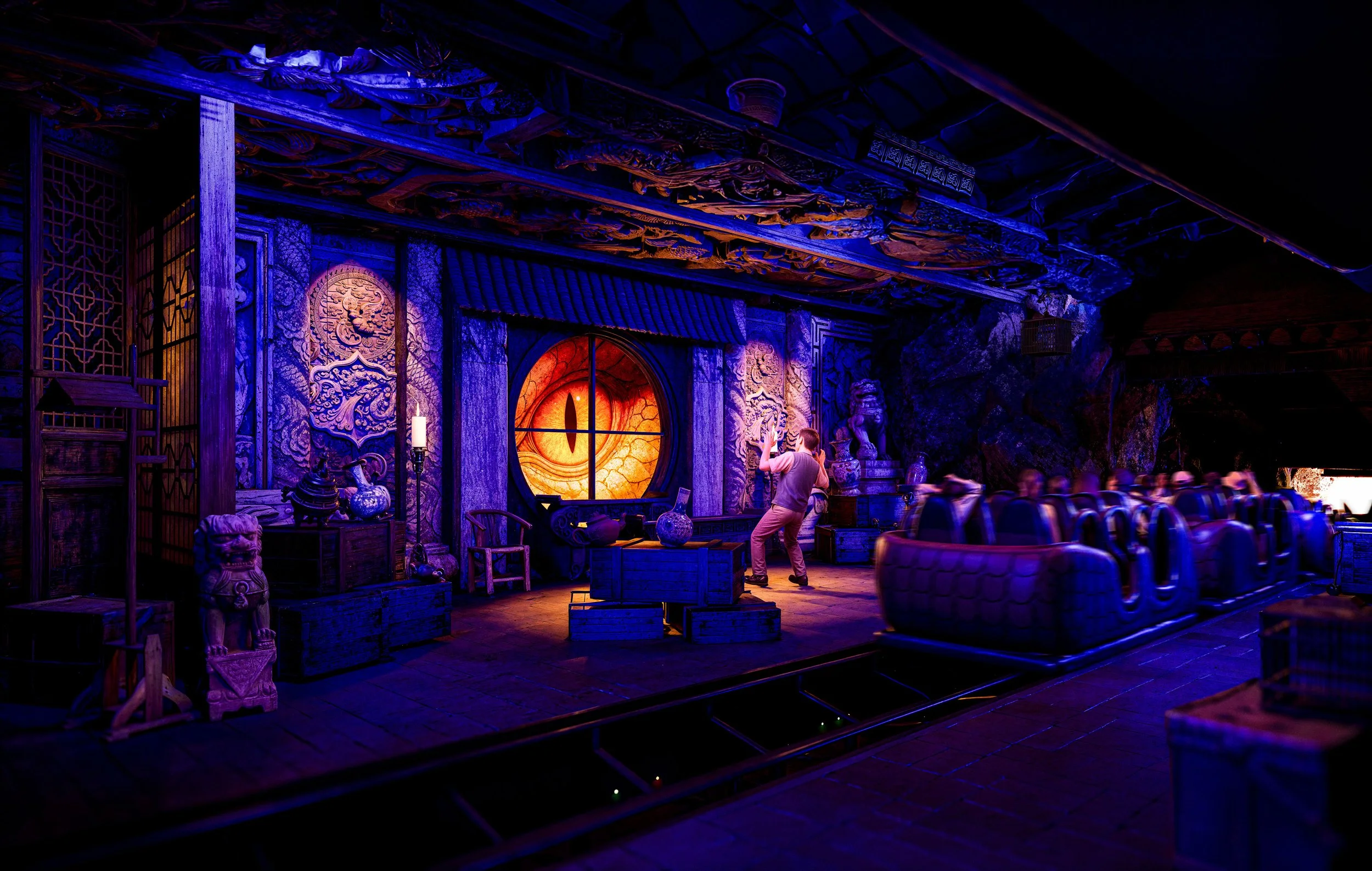 Dragon themed coaster concept interior with blue lighting and detailed rockwork