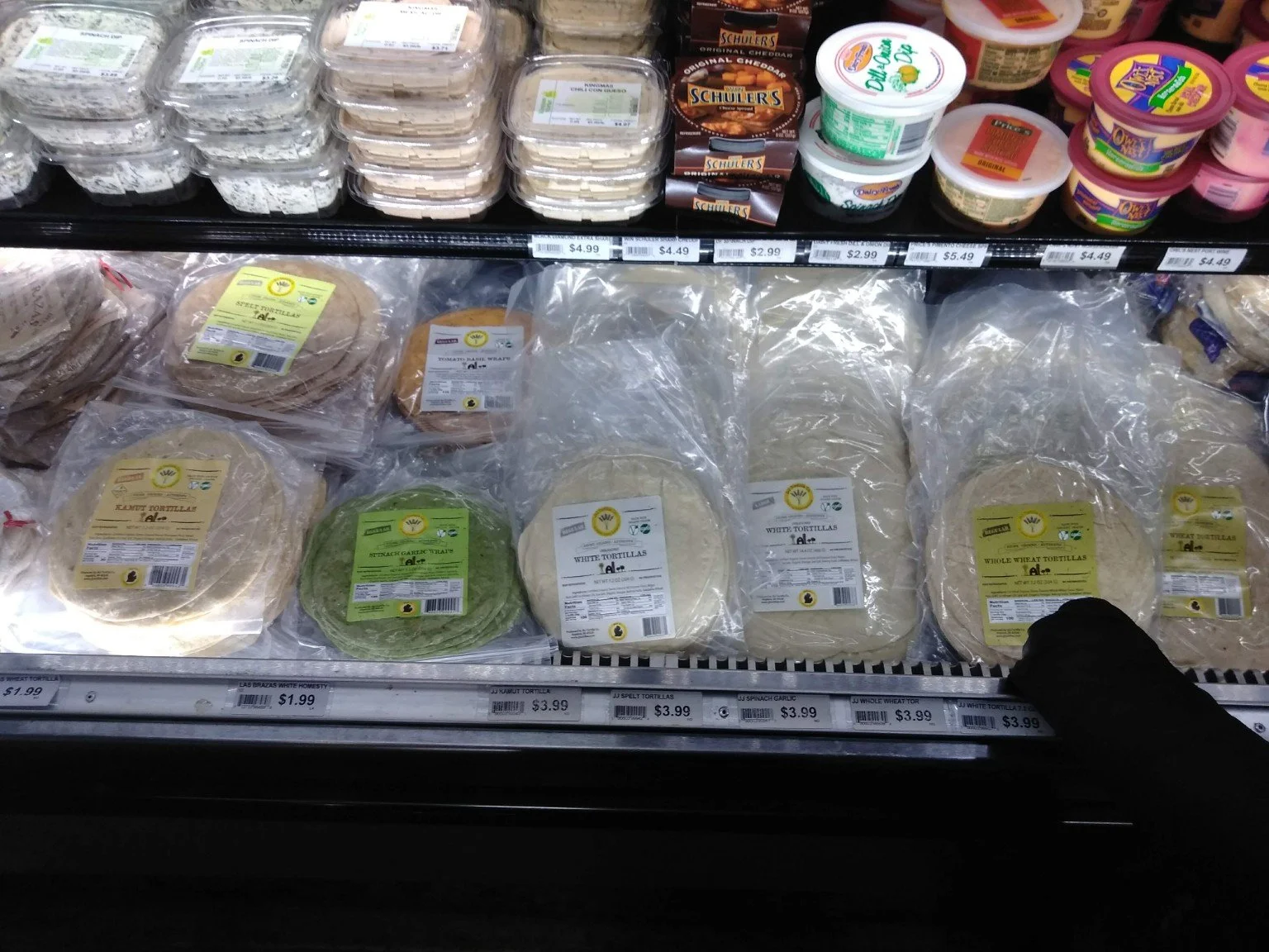 J&J tortilla varieties on a refrigerated store shelf