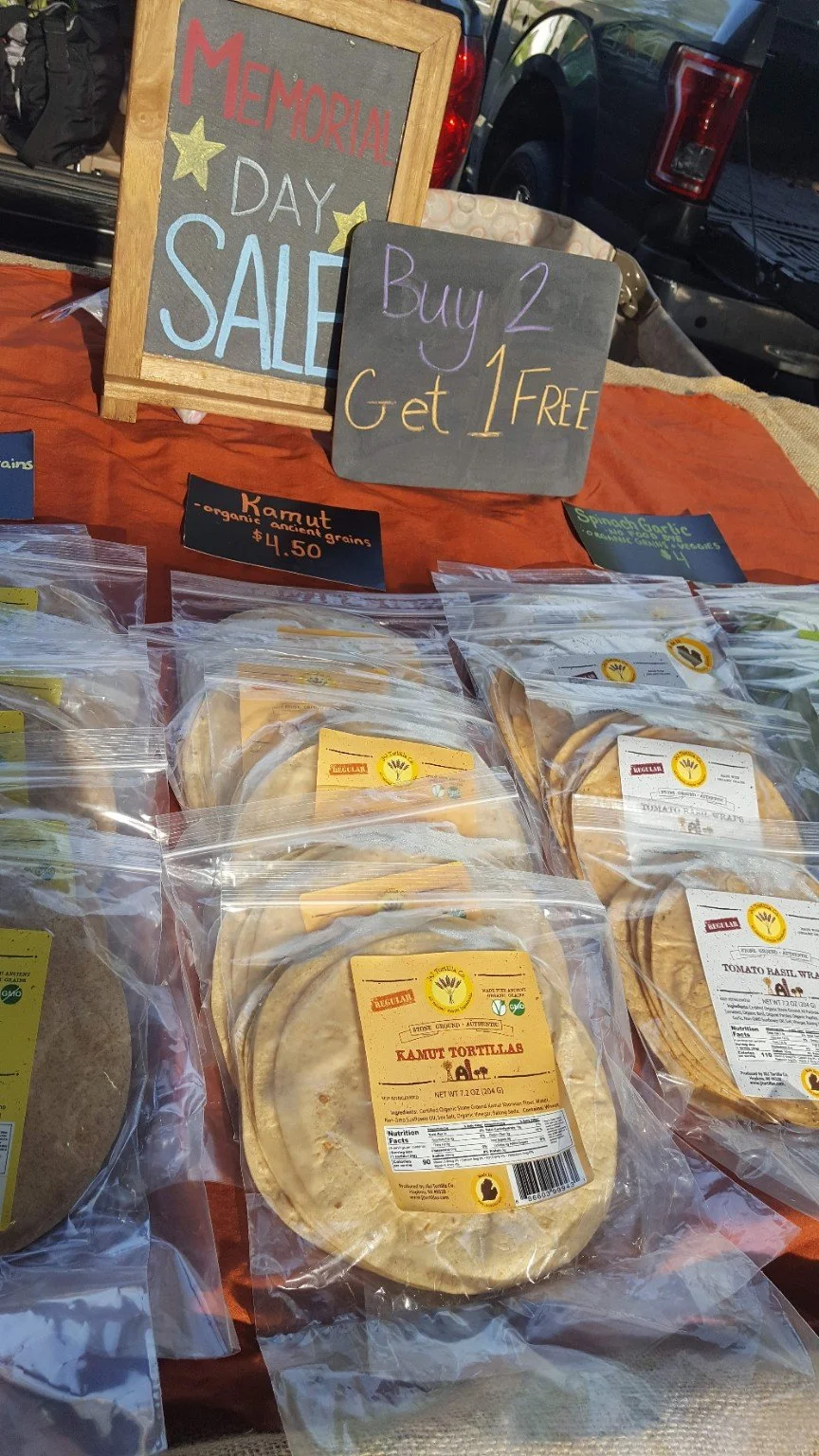 Earlier Kamut and Tomato Basil bags on a market table