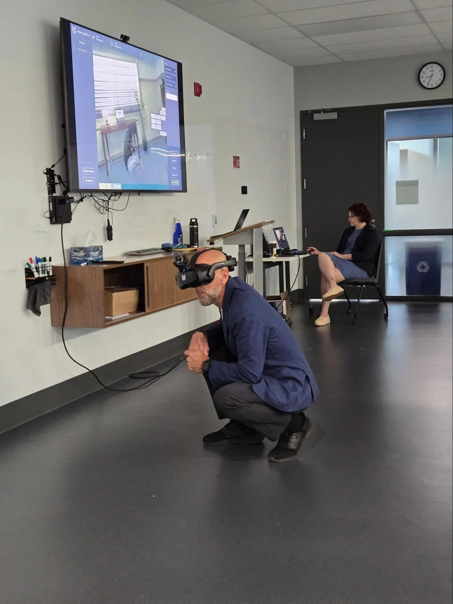 A trainee verbally engaging with a person in crisis during an MHCR scenario