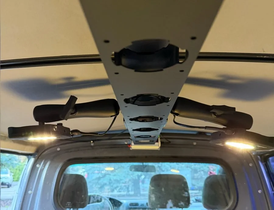 Two modules on a shared mount in a vehicle