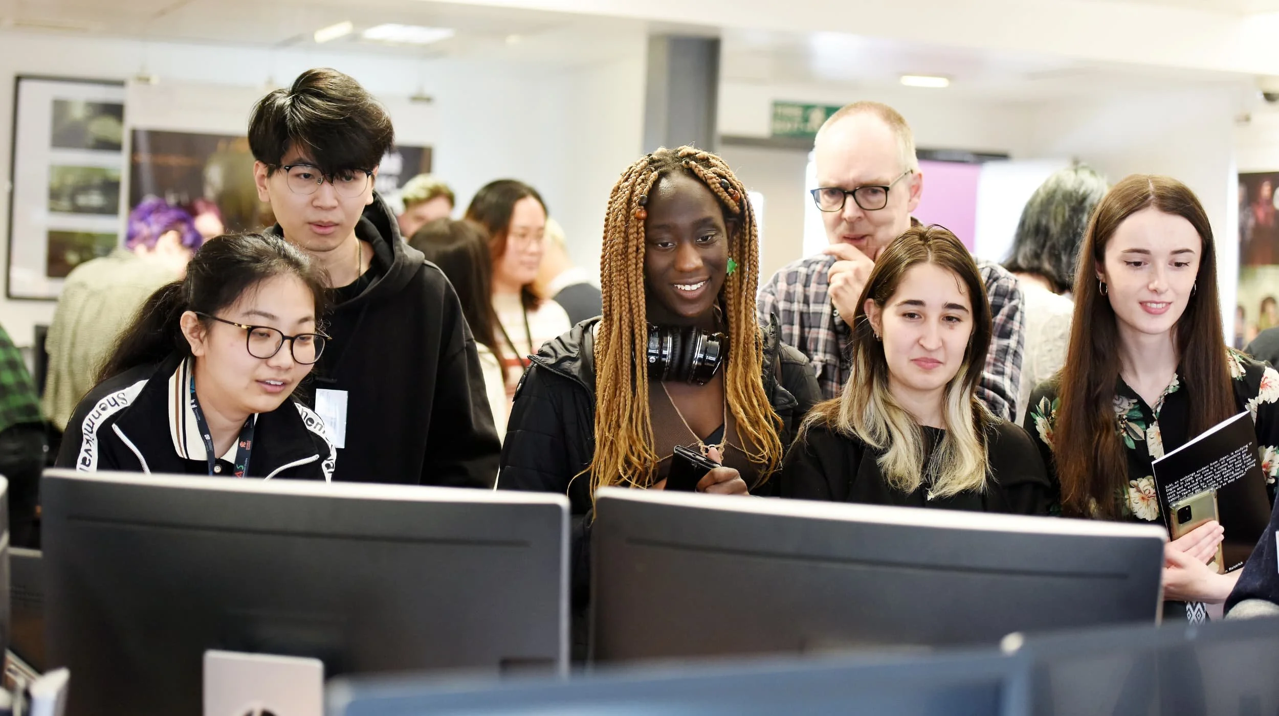 Students Working Together at Screens