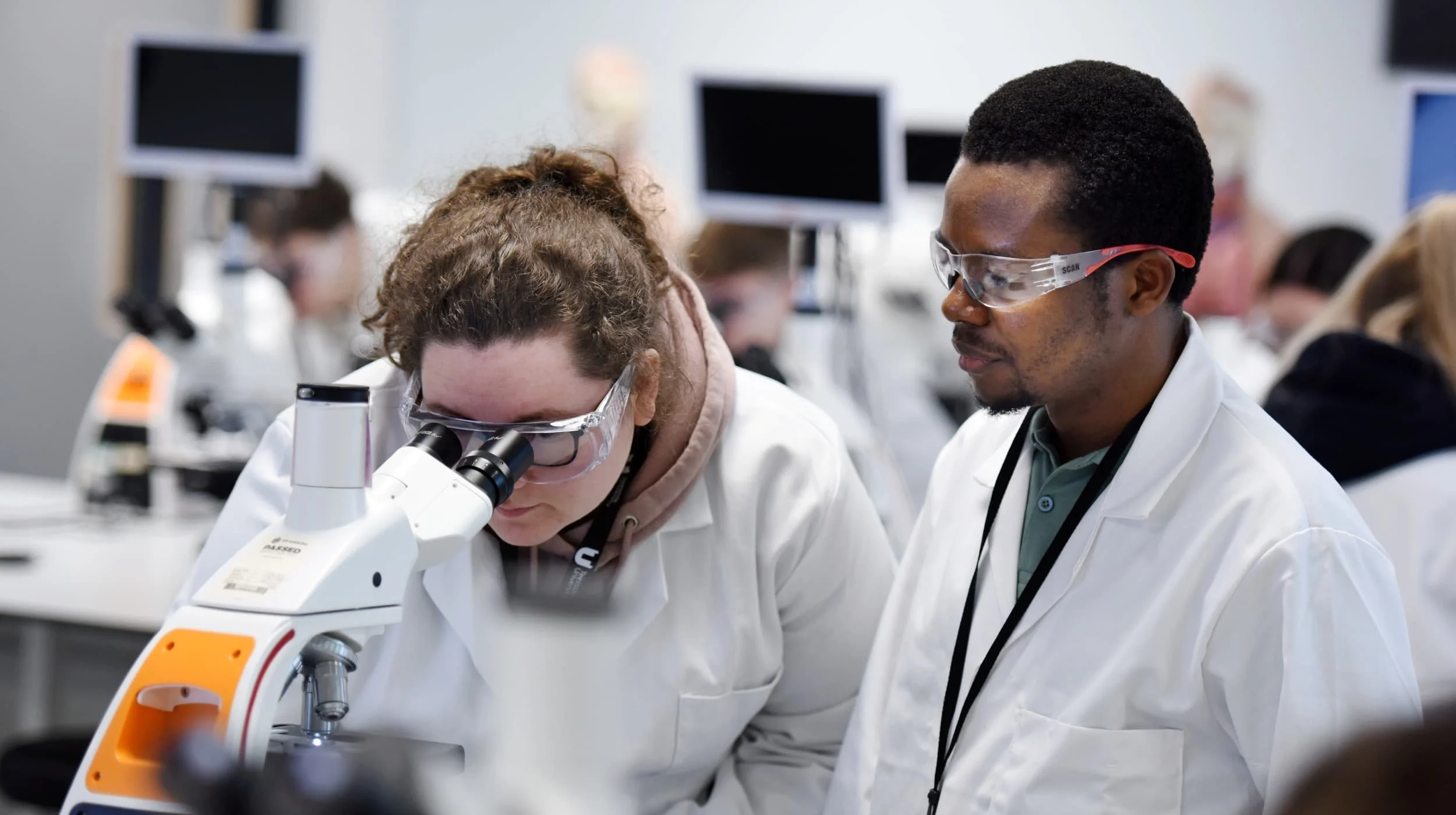 Students Using Microscope