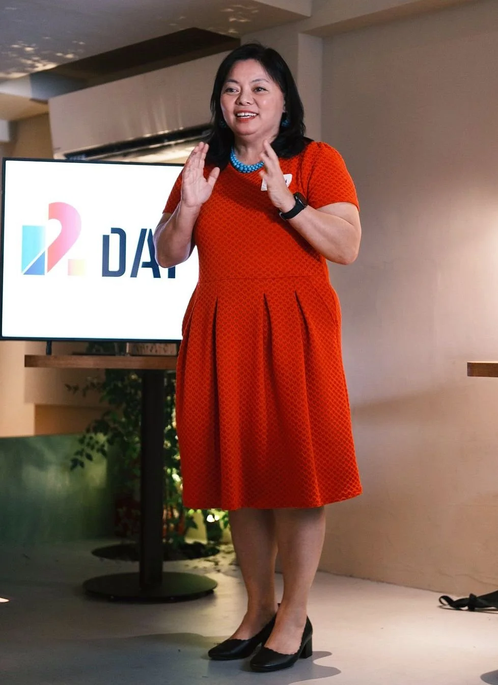 Jenny Hsu speaking at a Day 2 branded event