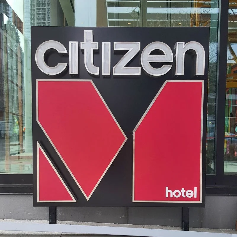 citizenM Seattle hotel exterior lightbox signage — fabricated and installed by Plumb Signs