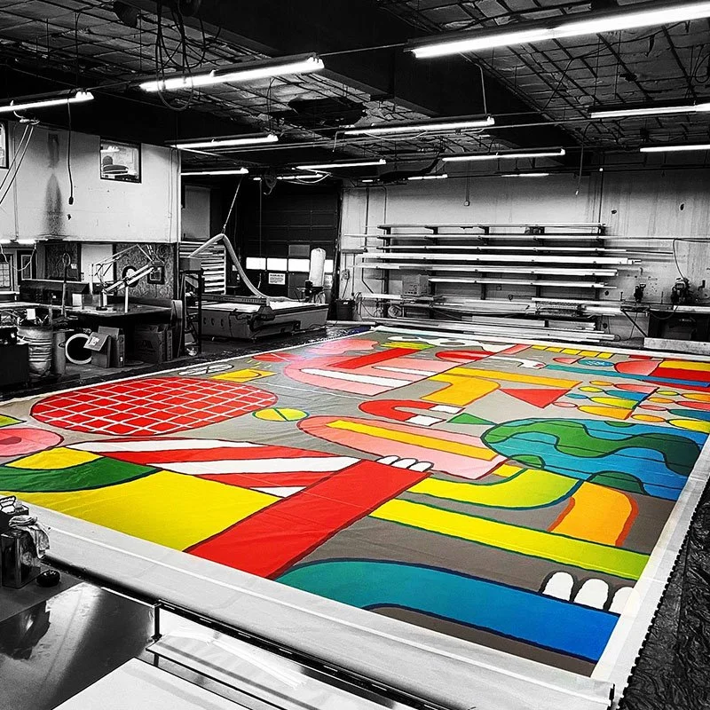 Workshop preparing vibrant large-format prints at Plumb Signs