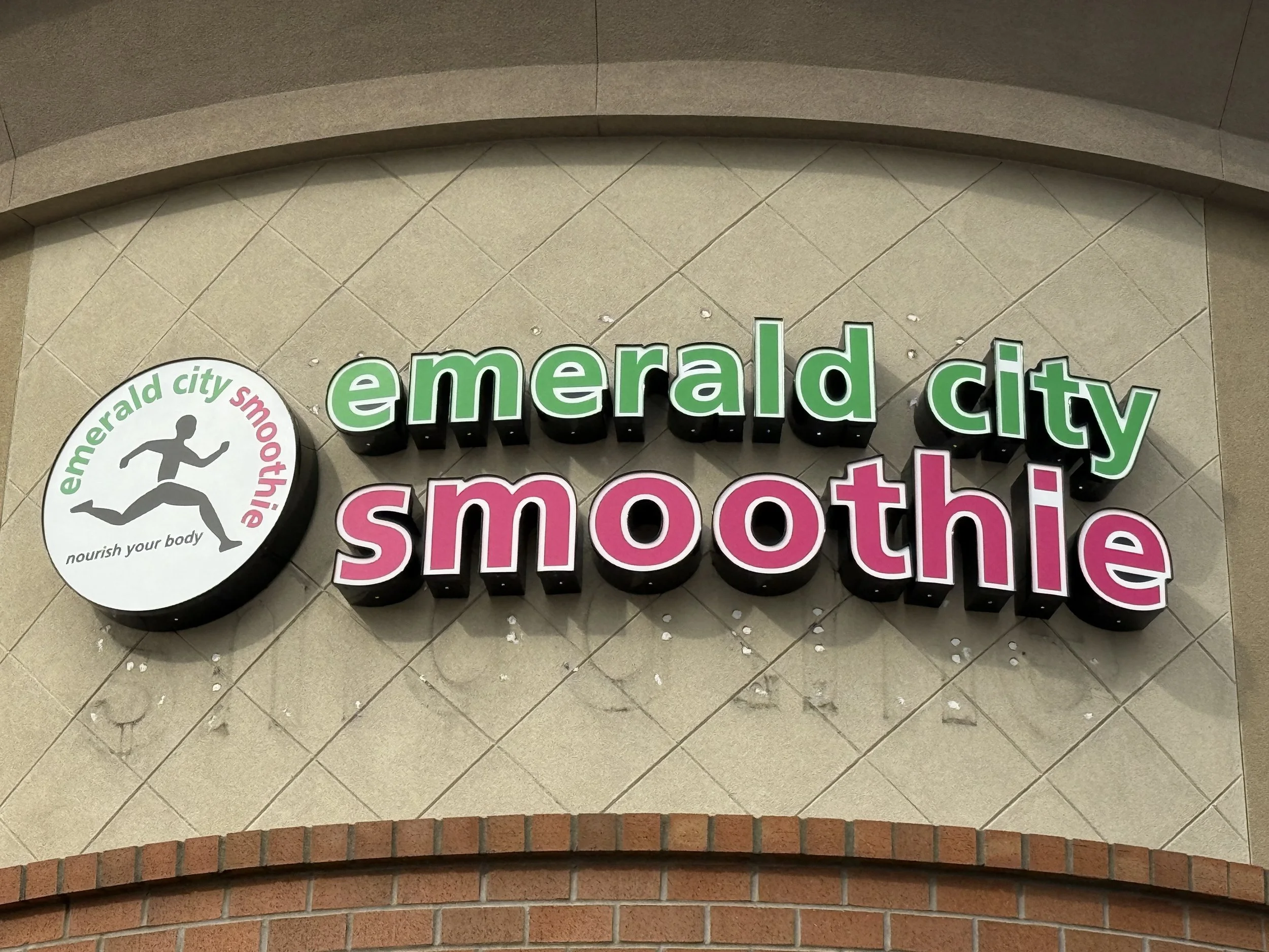 Plumb Signs technician preparing wall for new sign installation - Tacoma Washington