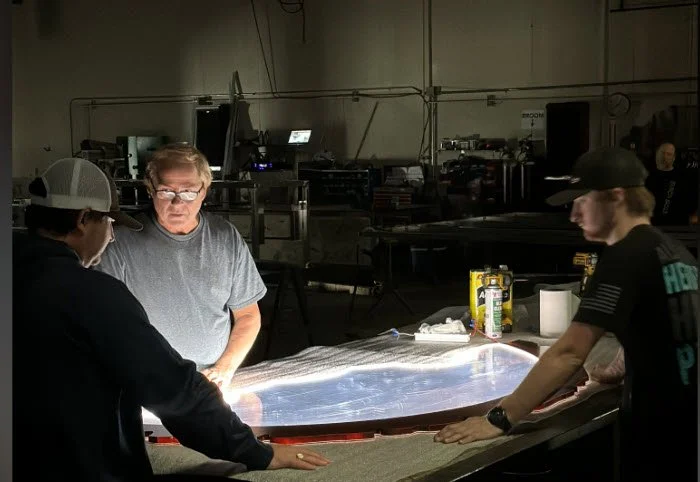 Mike - General Manager discussing with team