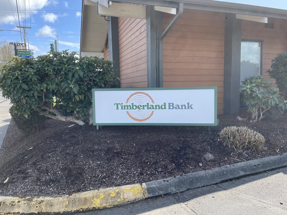 Timberland Bank monument sign — part of the 23-branch statewide rebrand managed from the bank's Olympia headquarters and delivered by Plumb Signs across six Washington counties