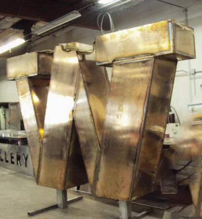 Before fabrication - bronze W in shop