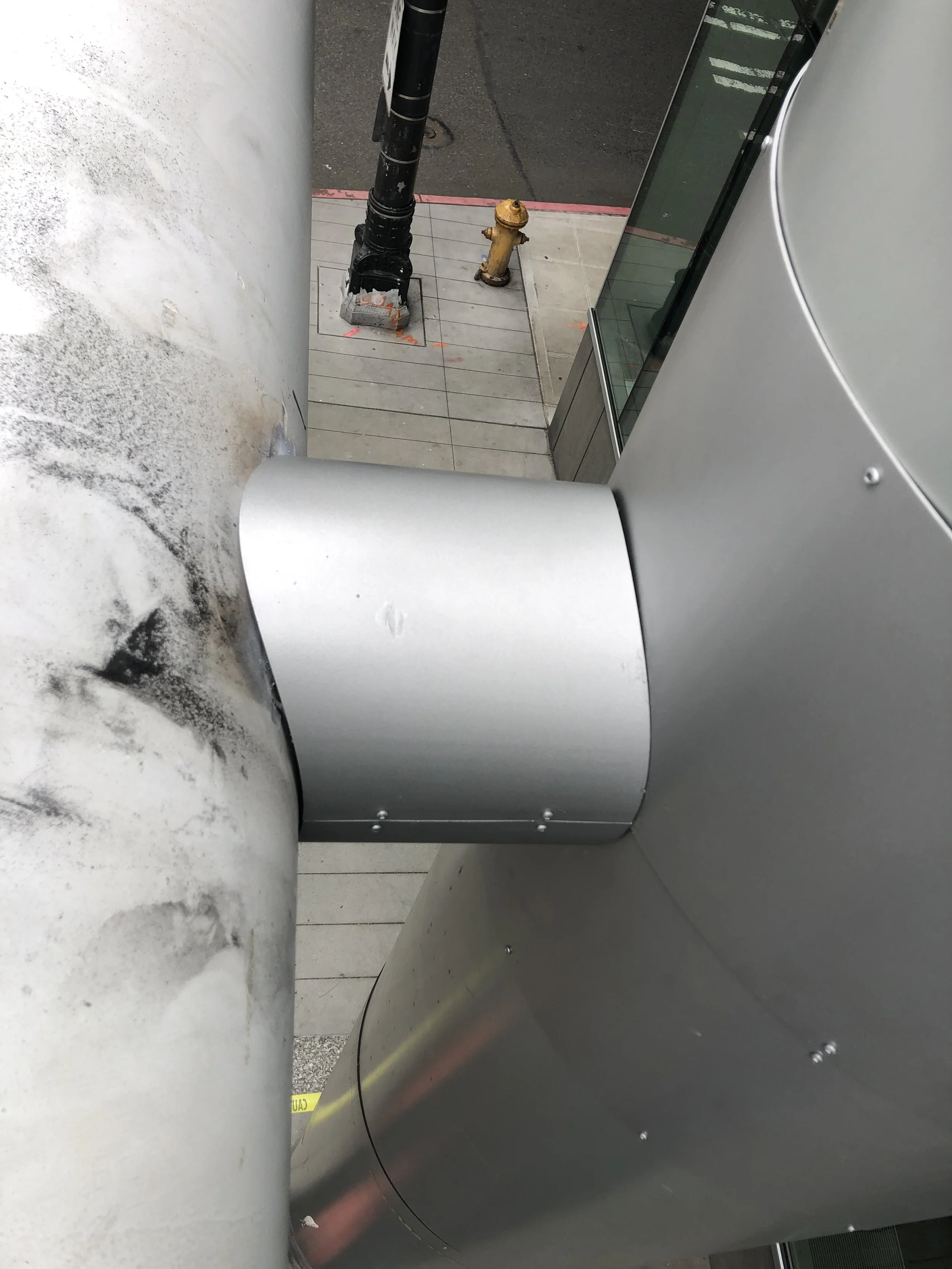 Crane hoisting illuminated signage frame – Plumb Signs