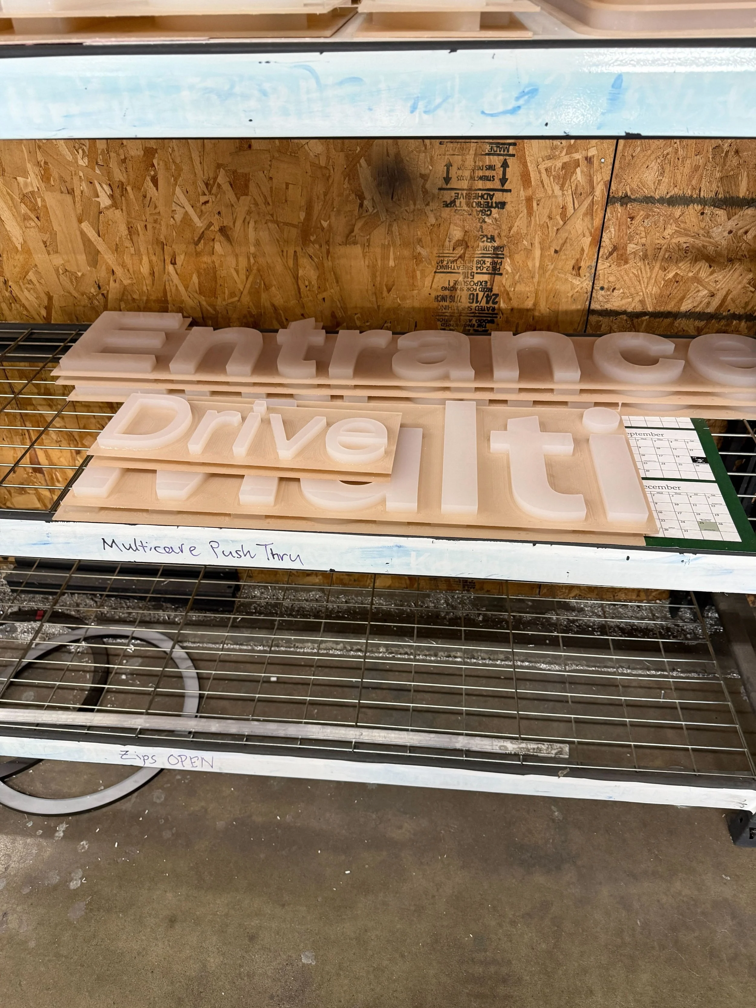 Translucent push-thru acrylic letters in production for MultiCare Gig Harbor's illuminated sign rebrand — Plumb Signs Tacoma