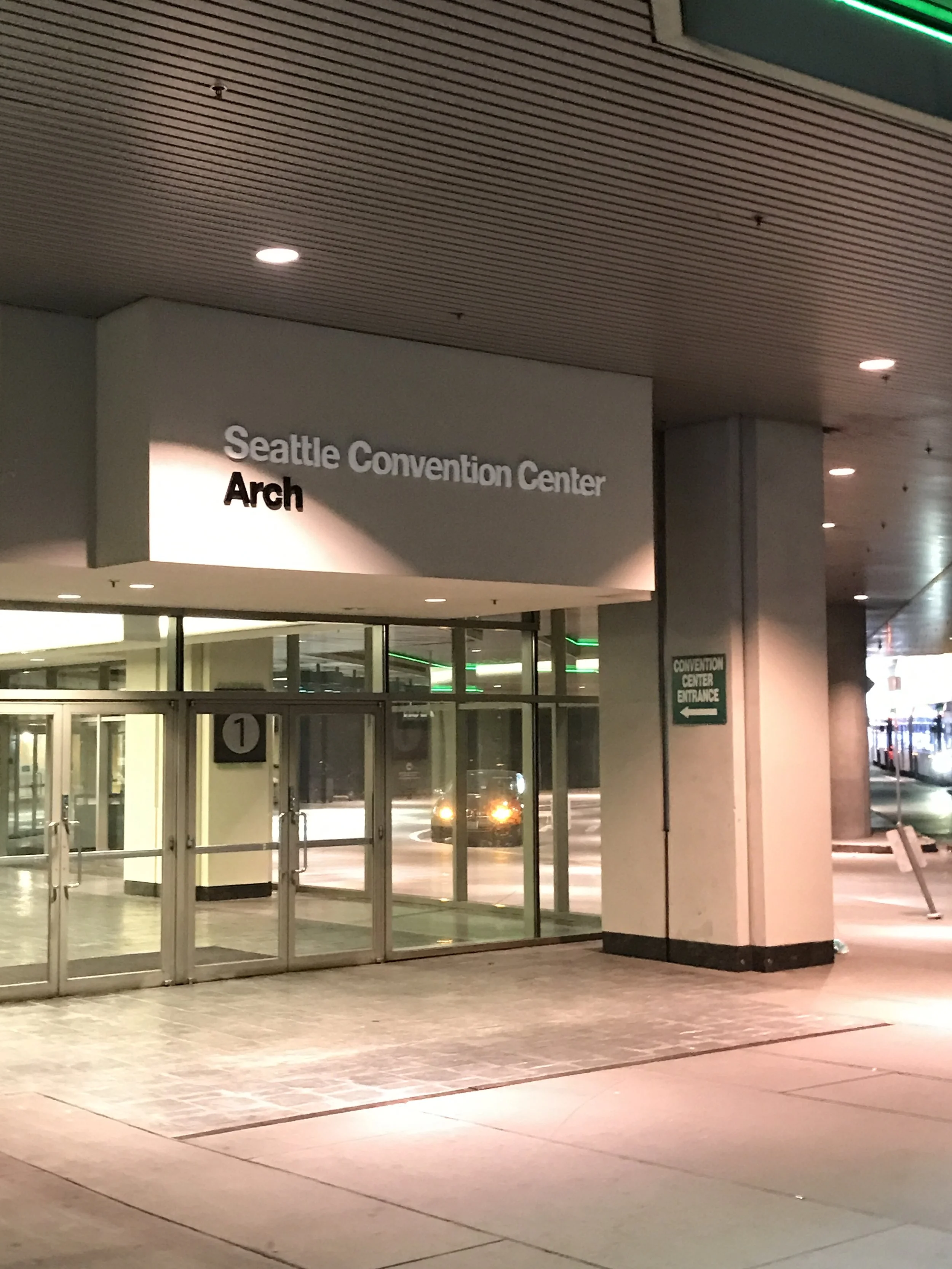Plumb Signs technicians installing Convention Center signage