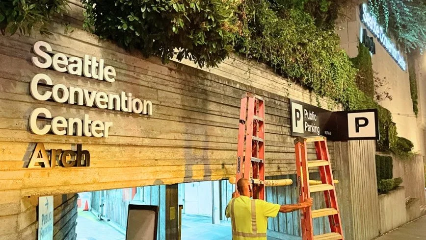 In-progress signage removal and install at Seattle Convention Center