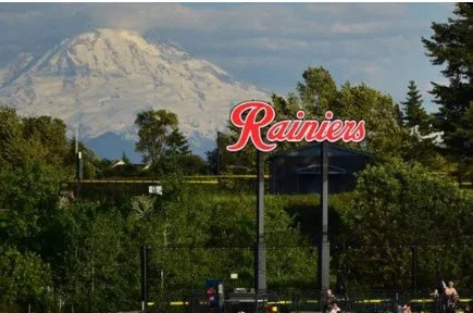 Cheney Stadium lettering with Tacoma skyline in background