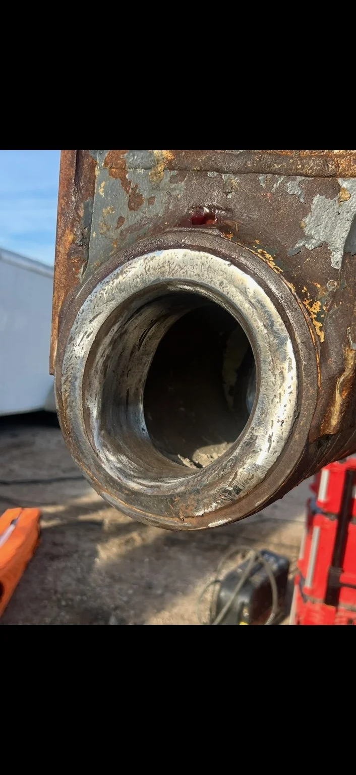 Worn equipment pivot bore before machining