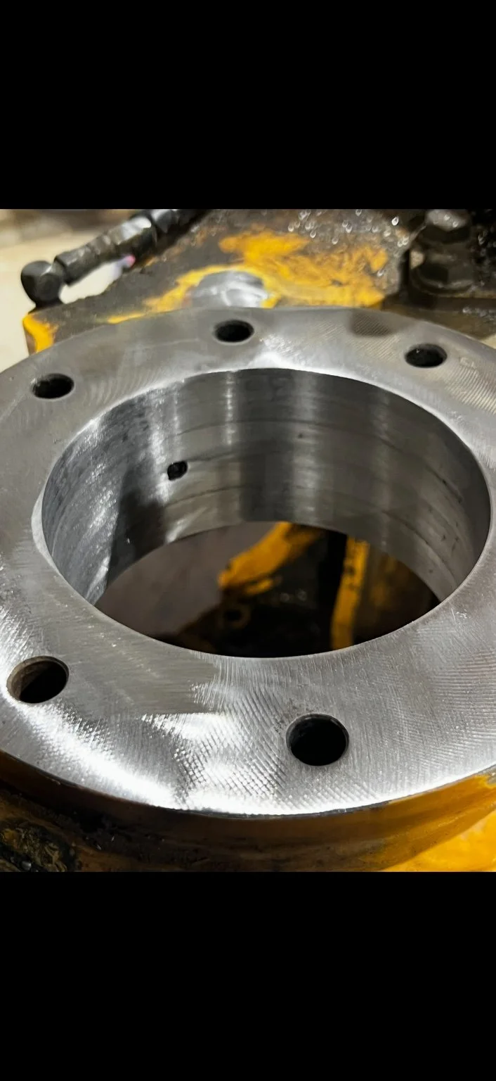 Machined flanged equipment bore after repair