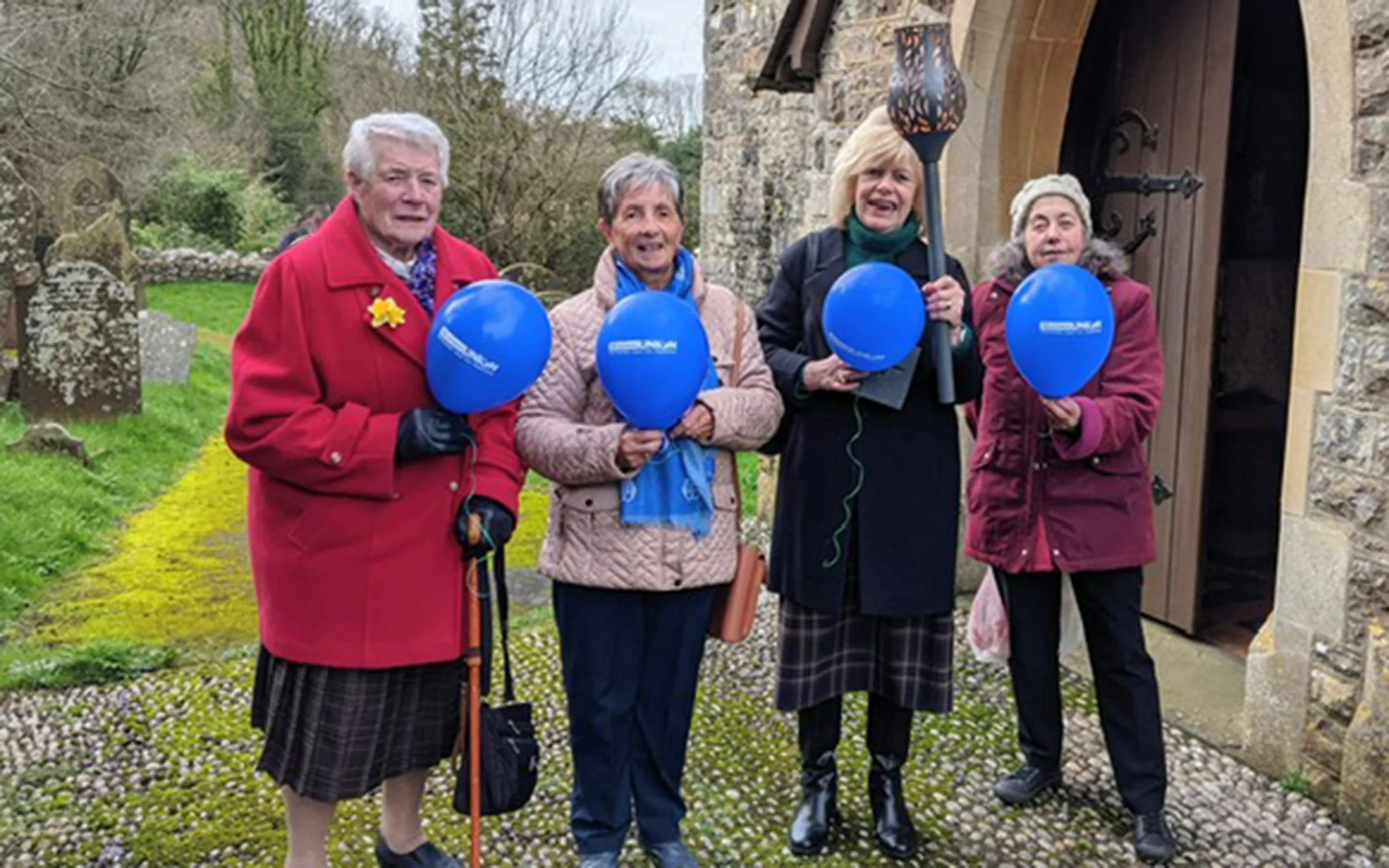 Mothers' Union members with the torch at Llanrhidian