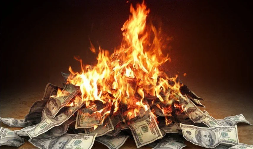 Money burning representing insurance savings with Me & You Insurance LLC affordable rates and comprehensive coverage in Arizona