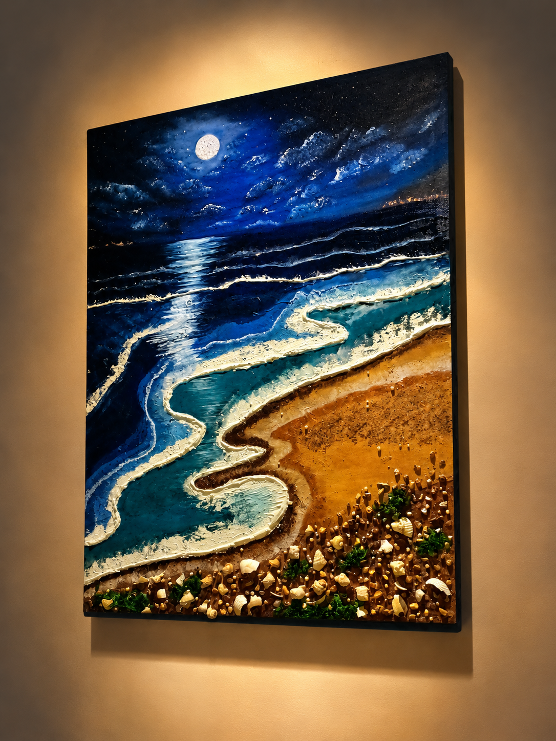 Textured artwork showing moonlit ocean waves and a golden shoreline.
