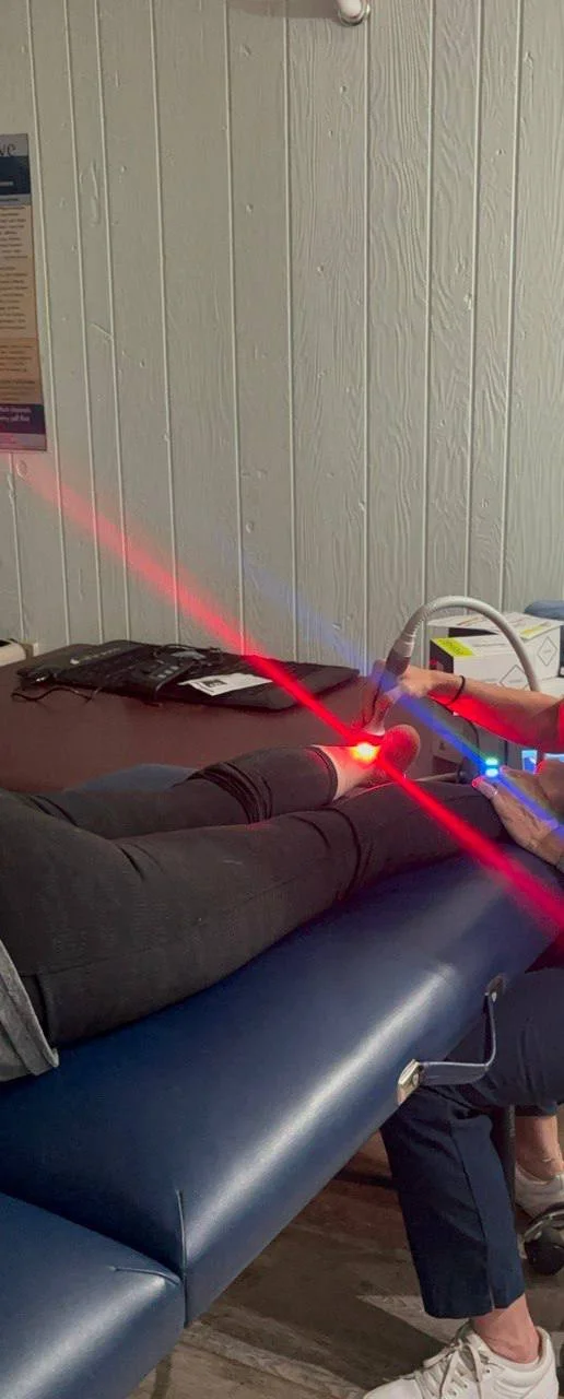 The LuminaHeal Class IV laser set up in a clinic treatment room