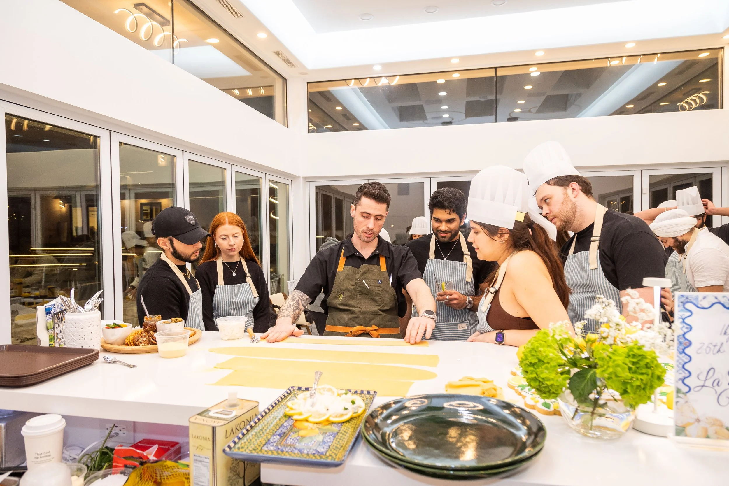 Kneading fresh pasta dough during an at-home cooking class