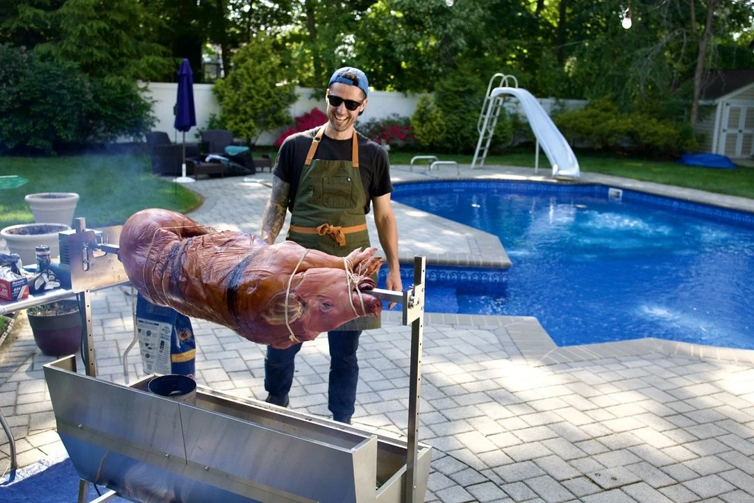 Guests gathered at a private hog roast feast