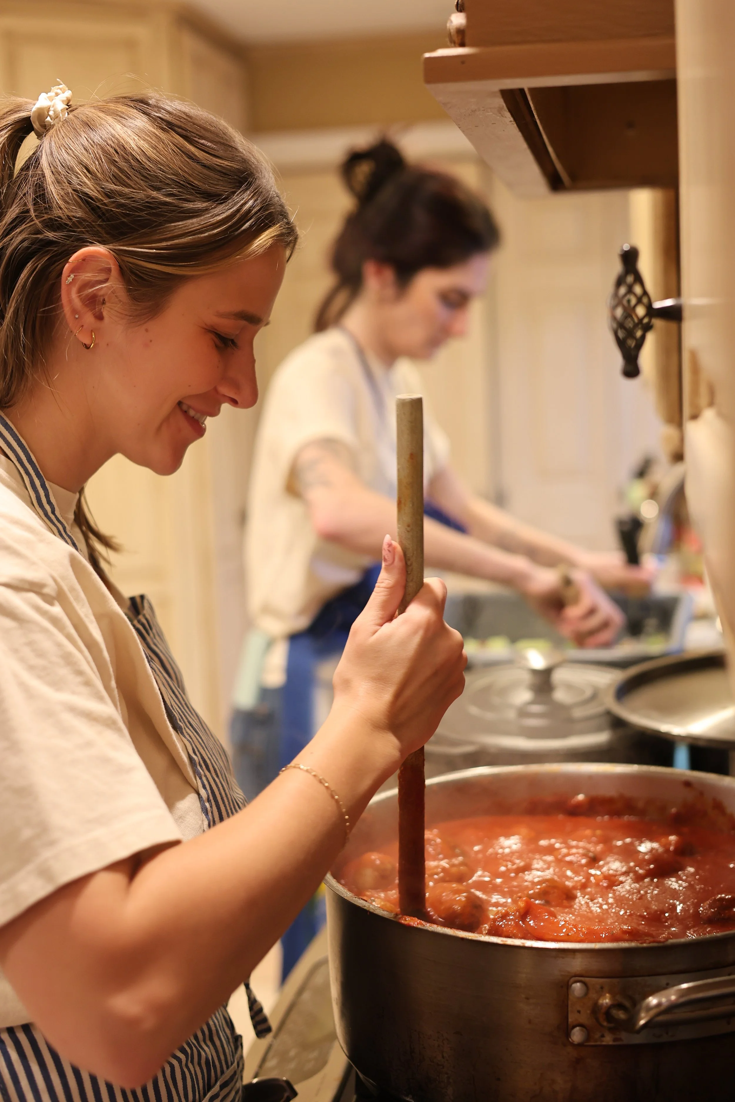 Hands-on pasta shaping during a private cooking class at home