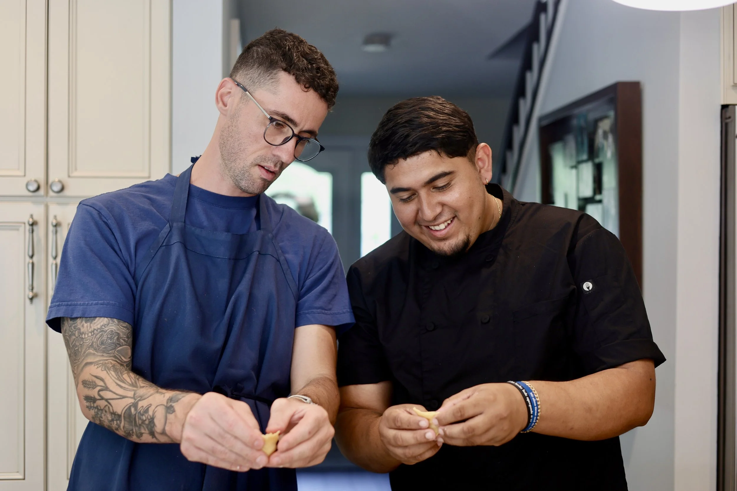 Pasta dough being rolled out during an at-home pasta class