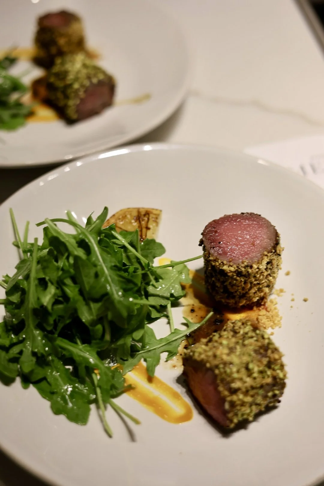 Herb-crusted lamb chop fine dining plate