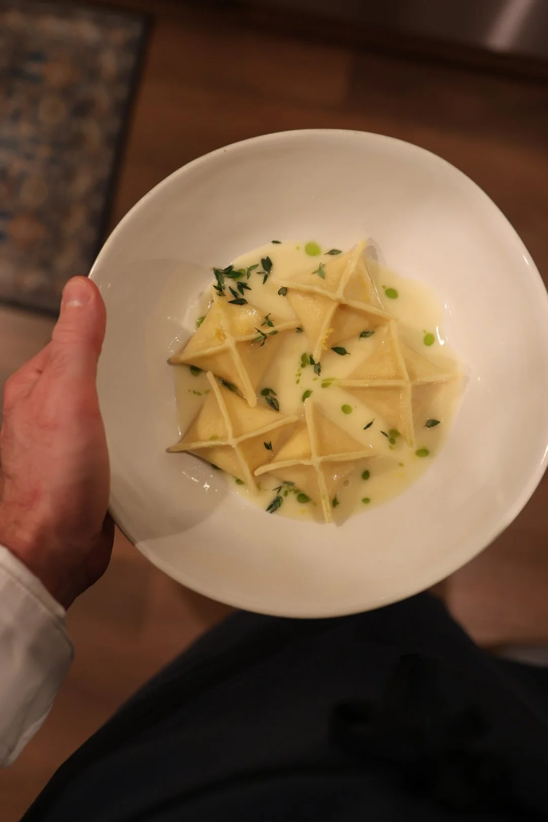 Handmade fagotini pasta served en brodo